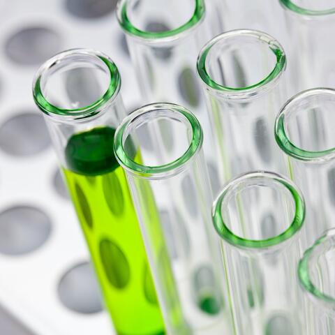 Vial filled with green liquid