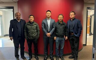 Shown here with Xuan is (from left to right): Dr. Mohammod Ali, Dr. Guoan Wang, Xuan Wang, Dr. Bin Zhang and Dr. Yi Wang
