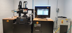 Wide shot of the Aconity3D MIDI laser powder bed fusion system
